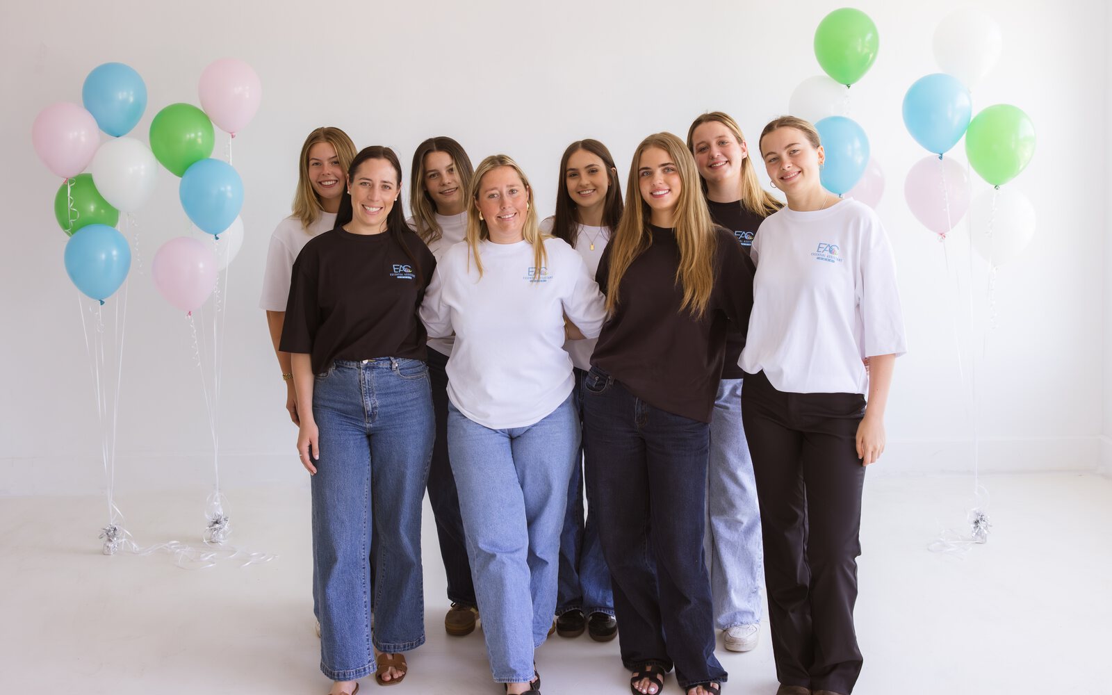 Essential Assistant Care support team together at a studio event