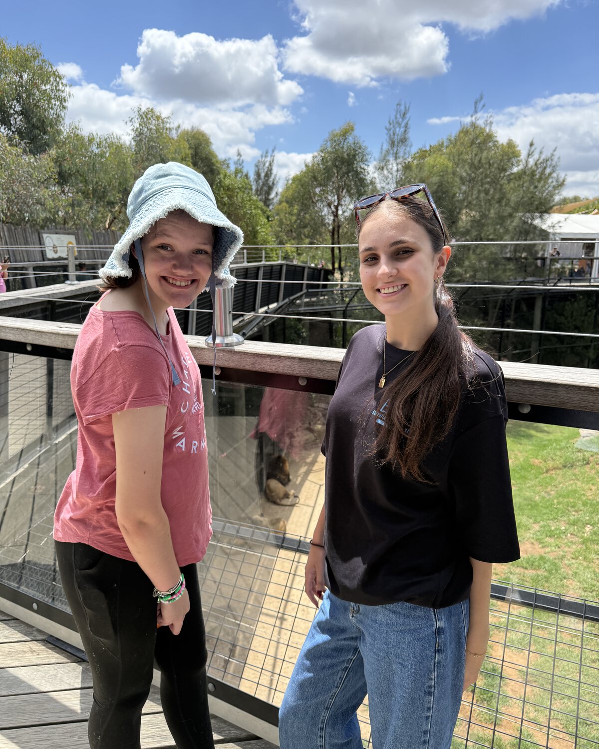Client and support worker smiling together during a community outing
