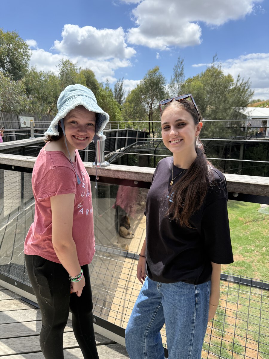 A client and support worker enjoying a community outing together