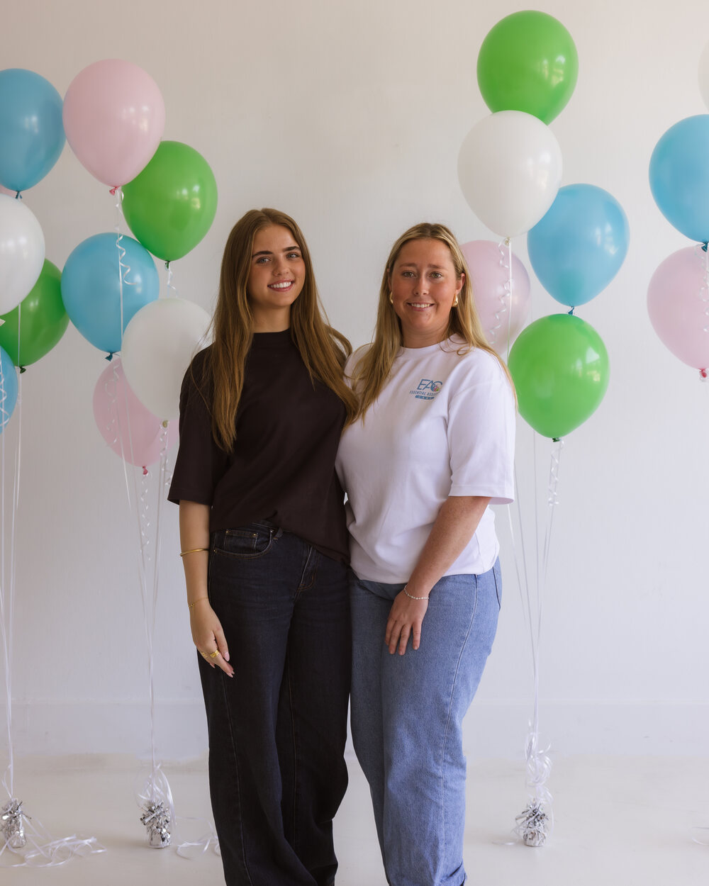 Brooke Threlfo standing with an Essential Assistant Care team member