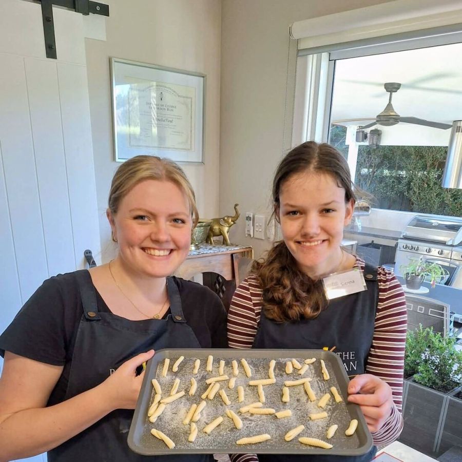 Client and support worker presenting a baking activity