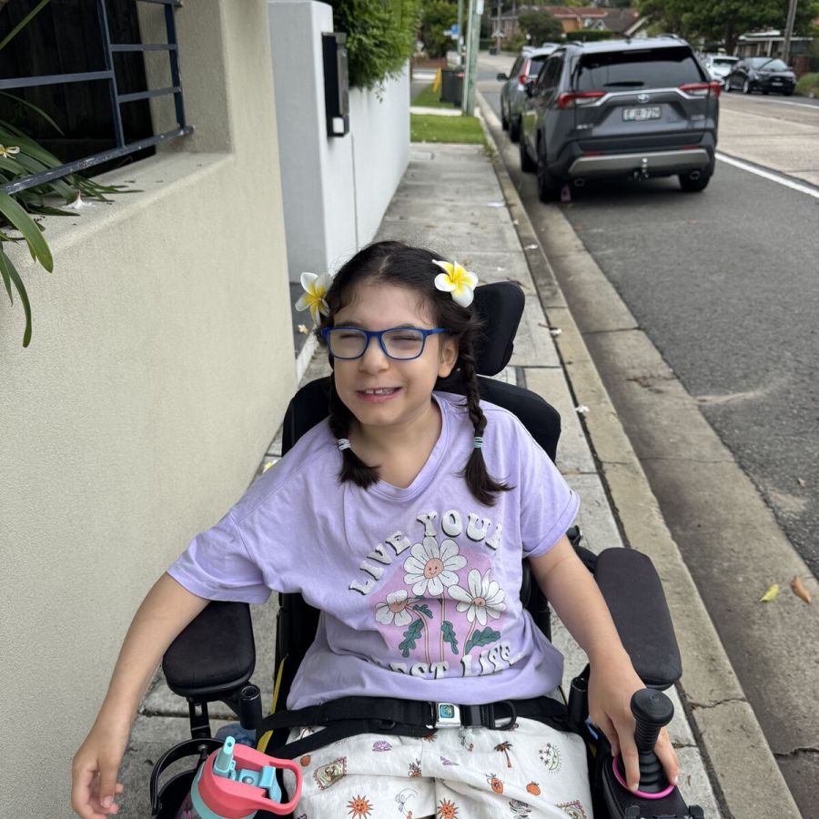Client using a wheelchair during a neighbourhood outing