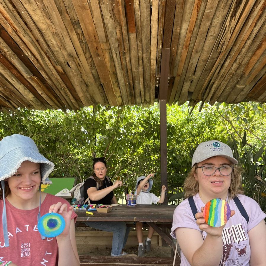 Clients sharing colourful art activities outdoors